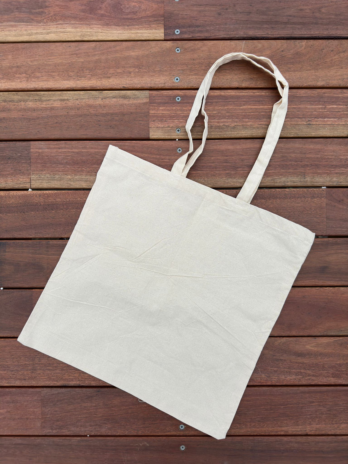 Plain cream unbleached cotton tote bag with long shoulder handles, no print